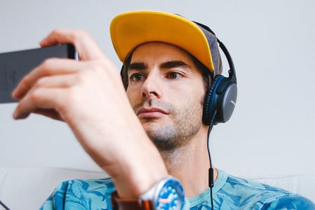 Man playing game on mobile device